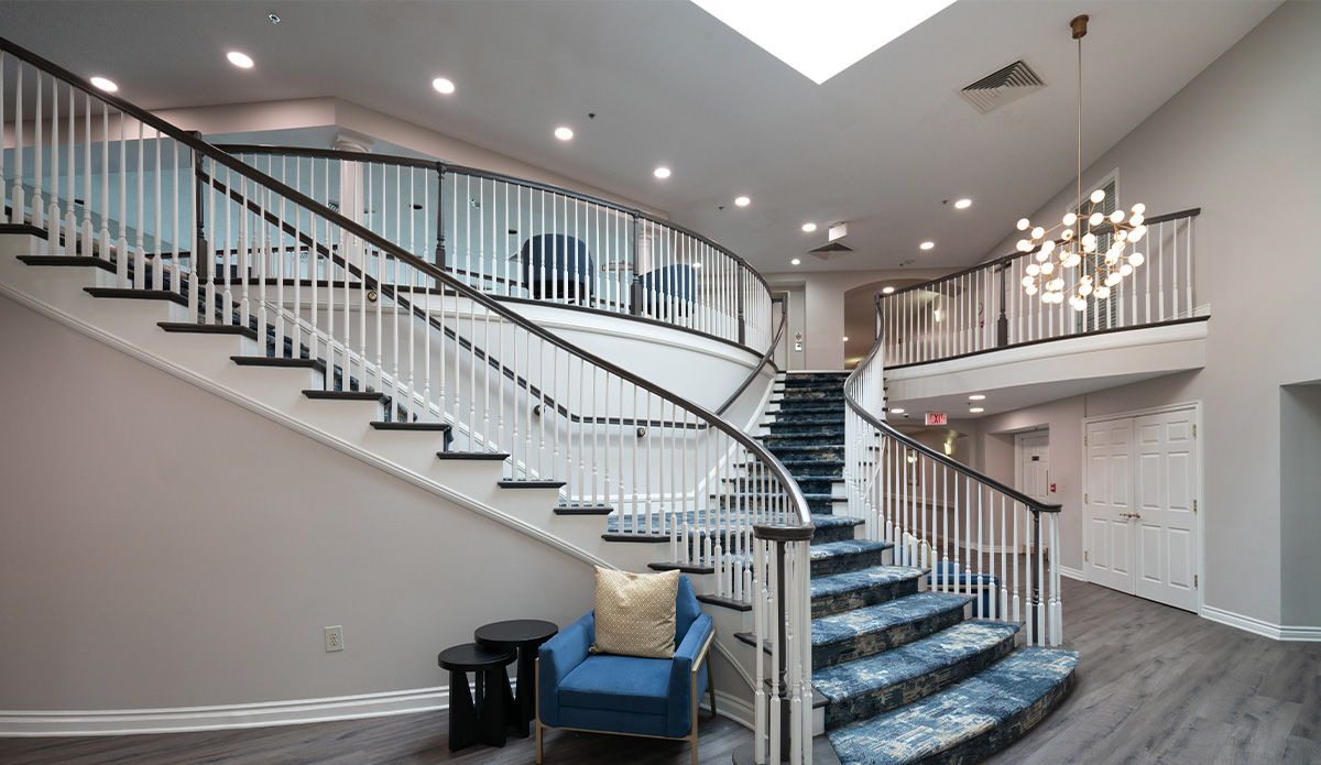 lobby entrance features a welcoming staircase leading up to the main area of the building.