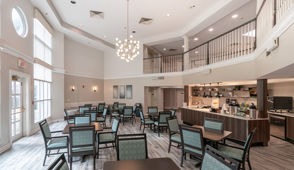 dining room in a senior living community, featuring tables set